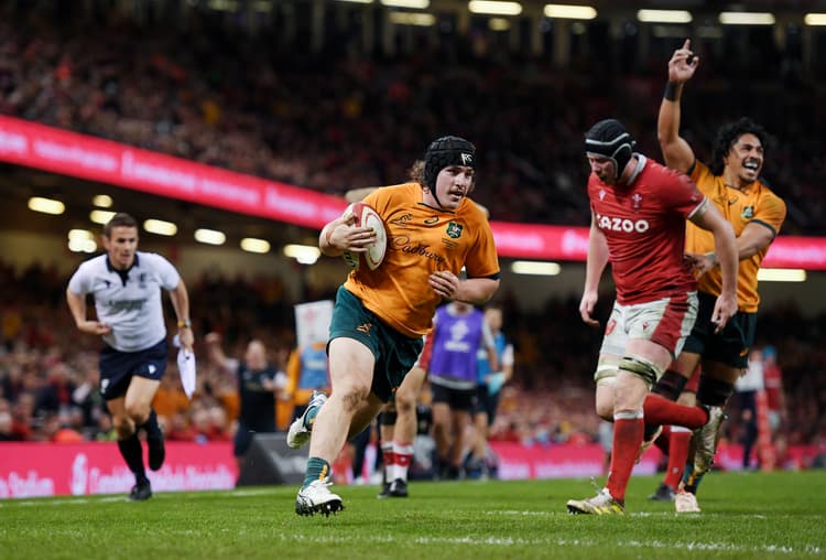 Lachlan Lonergan on his way to scoring the match winning try against Wales in 2022. Photo: Getty Images